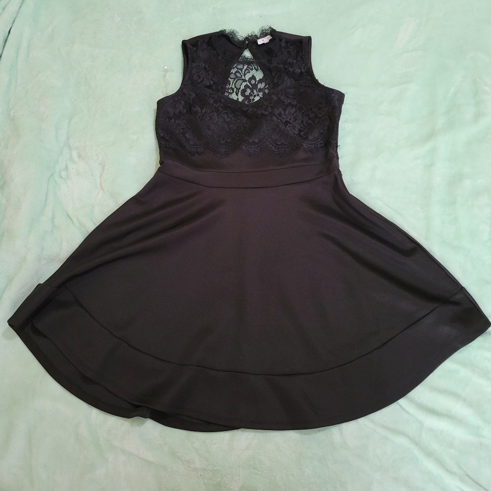 Nice Ardene A line sleeveless black dress with lace accents.